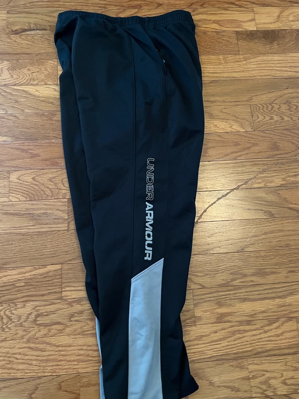 YXL youth boy’s Under Armour Black Track Pants with Gray Reflective Panel